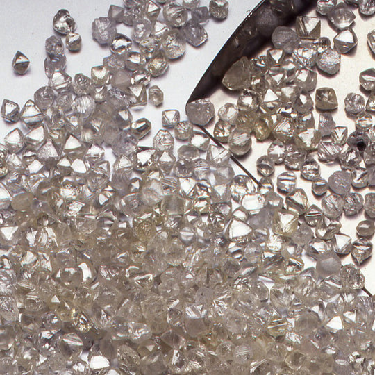 Natural colourless rough diamonds being sorted before cutting and polishing